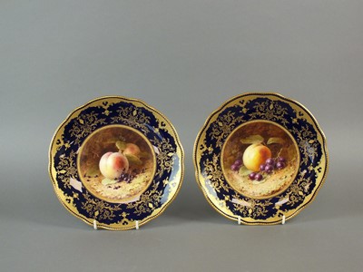 Lot 342 - A pair of Coalport plates painted with fruit by Chivers