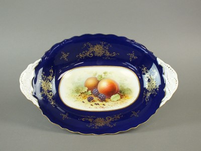 Lot 168 - A Coalport oval dish painted with fruit by F. Howard.