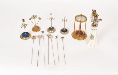 Lot 45 - A collection of hat pins and stands