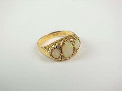 Lot 381 - An early 20th century 18ct gold opal and diamond ring