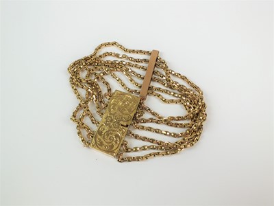 Lot 65 - A yellow metal multi chain bracelet