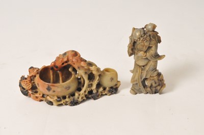 Lot 464 - A 19th century Chinese carved hardstone study of a sage with peaches