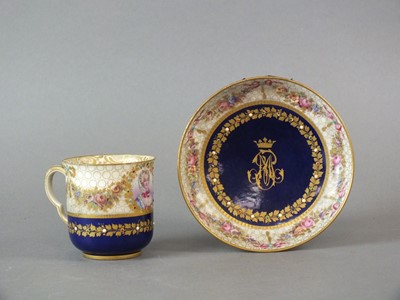 Lot 213 - A Sèvres-style porcelain jewelled and monogrammed coffee cup and saucer