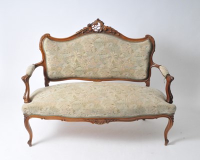 Lot 555 - A small French walnut framed upholstered parlour settee