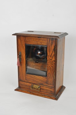 Lot 410 - A small oak smoker's cabinet