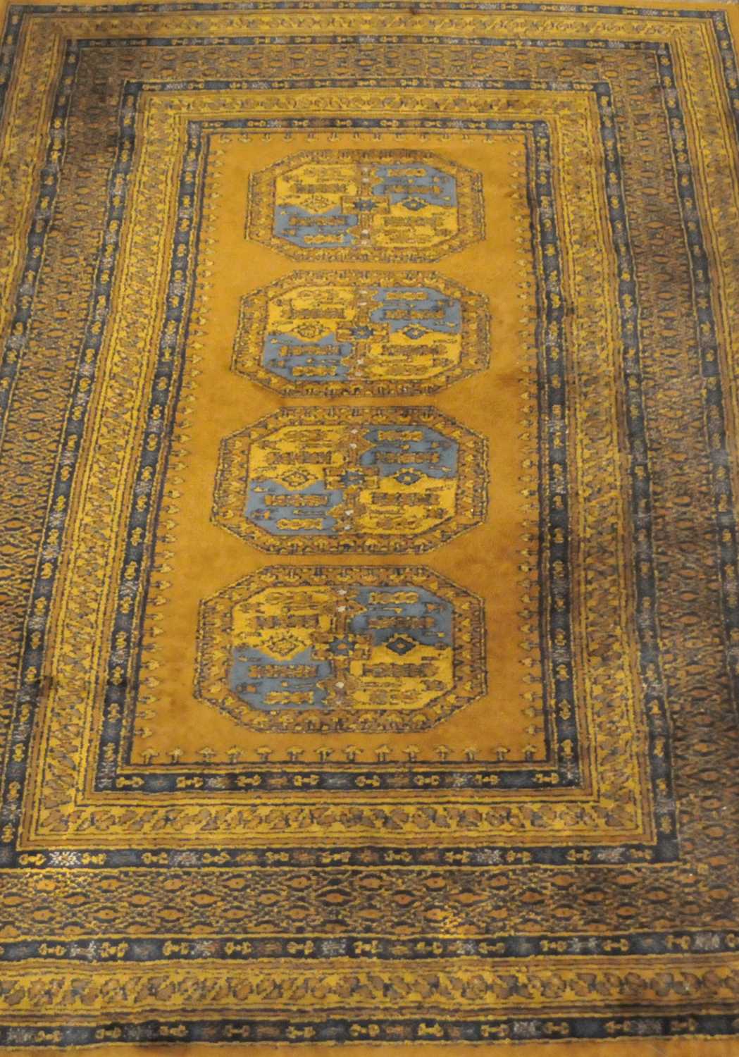 Lot 22 - A Turkoman style rug, the central panel with...