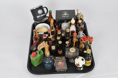 Lot 352 - A small collection of spirit miniatures and related effects.