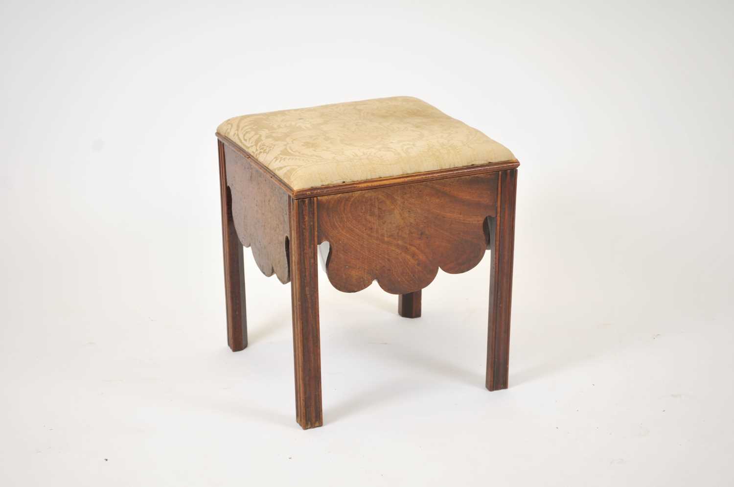 Lot 562 - A George II mahogany veneered commode stool,...