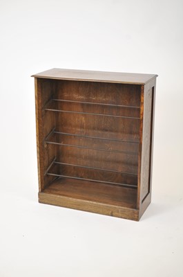 Lot 155 - An early 20th century stained oak shoe rack...