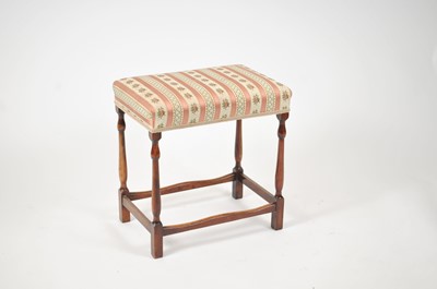 Lot 164 - An early-mid 20th century stained beech stool,...