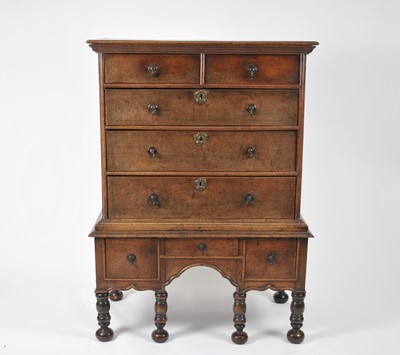 Lot 50 - An early 18th century oak chest on stand,...
