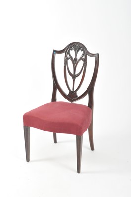 Lot 586 - An Edwardian mahogany kidney shaped desk and a single dining chair