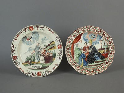 Lot 329 - Two Dutch-decorated creamware plates