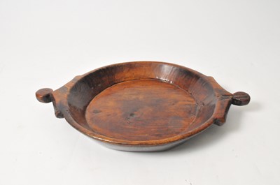 Lot 422 - A large 19th century treen charger, with cut...