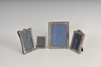 Lot 340 - A collection of four silver mounted photograph frames