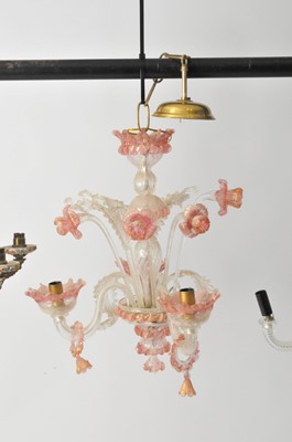 Lot 572 - A cranberry tinted three-light Venetian glass chandelier.