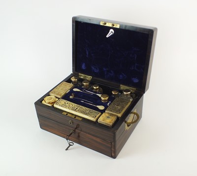 Lot 130 - A William IV Cormandel cased silver gilt travelling set