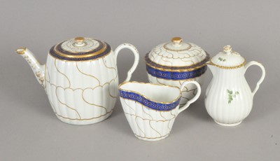 Lot 194 - Worcester teapot, sucrier and cream jug, circa 1785