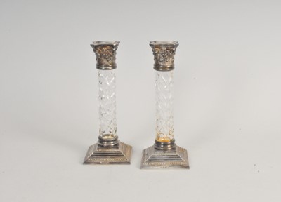 Lot 95 - A pair of silver mounted glass candlesticks