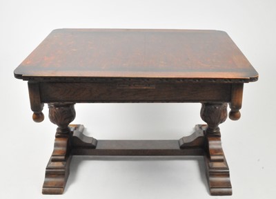 Lot 336 - A heavy oak draw-leaf dining table, with...