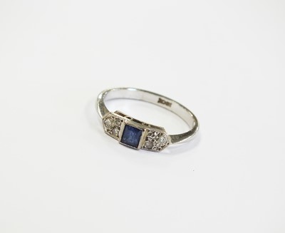 Lot 393 - A three stone sapphire and diamond ring