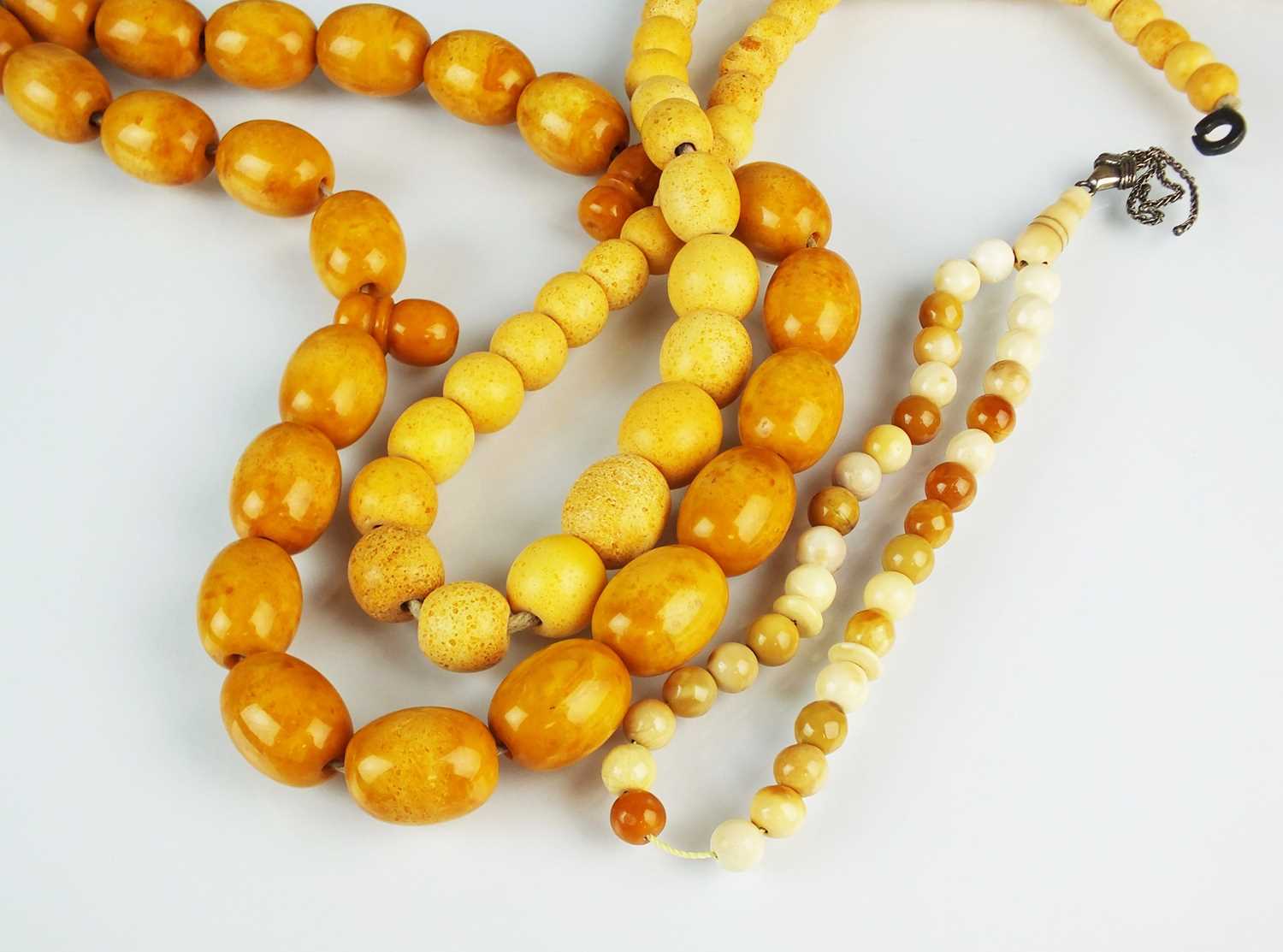 Lot 169 - Two pressed/reconstituted amber necklaces