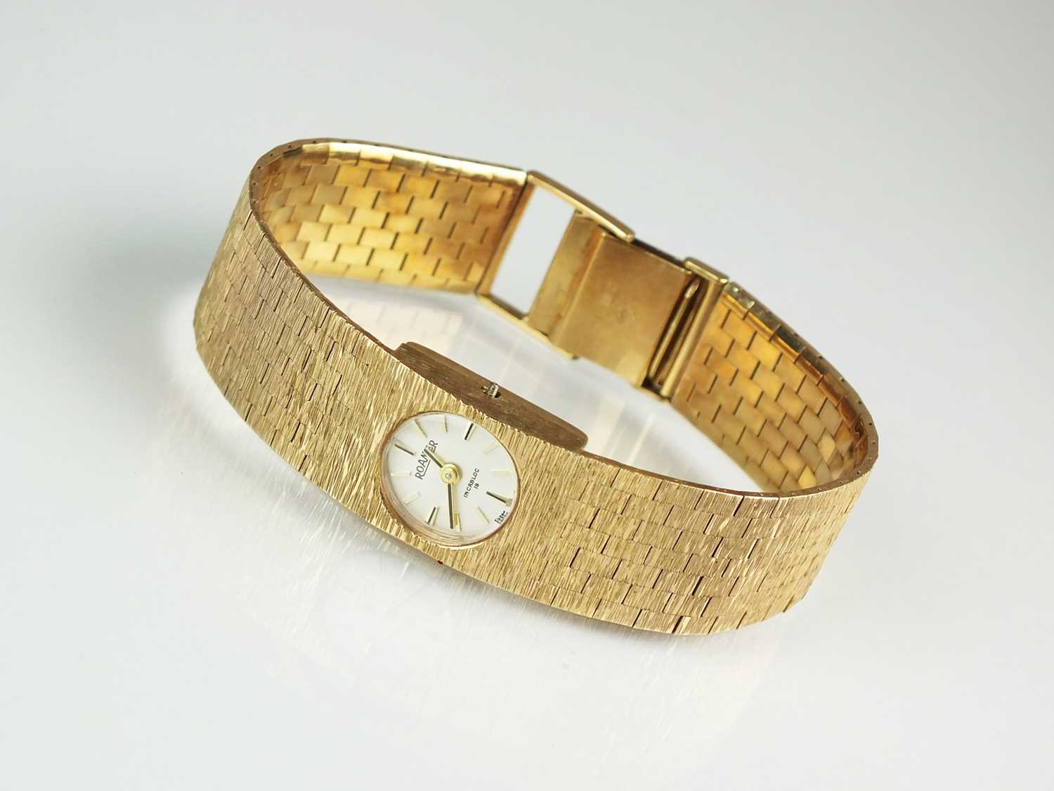 Lot 176 - A 1970's 9ct gold Roamer bracelet wristwatch
