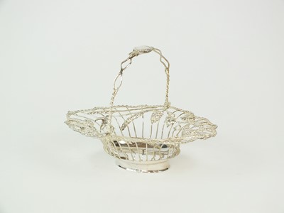 Lot 122 - A George III silver swing handled sweetmeats basket