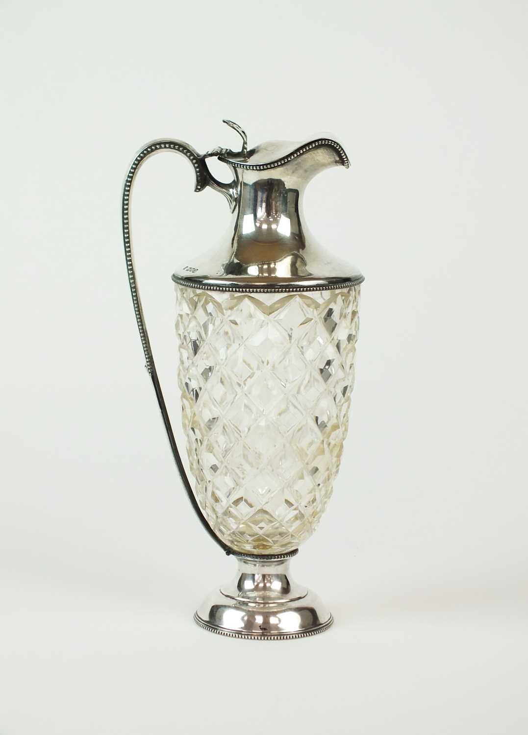 Lot 116 - An early 20th century silver mounted ewer