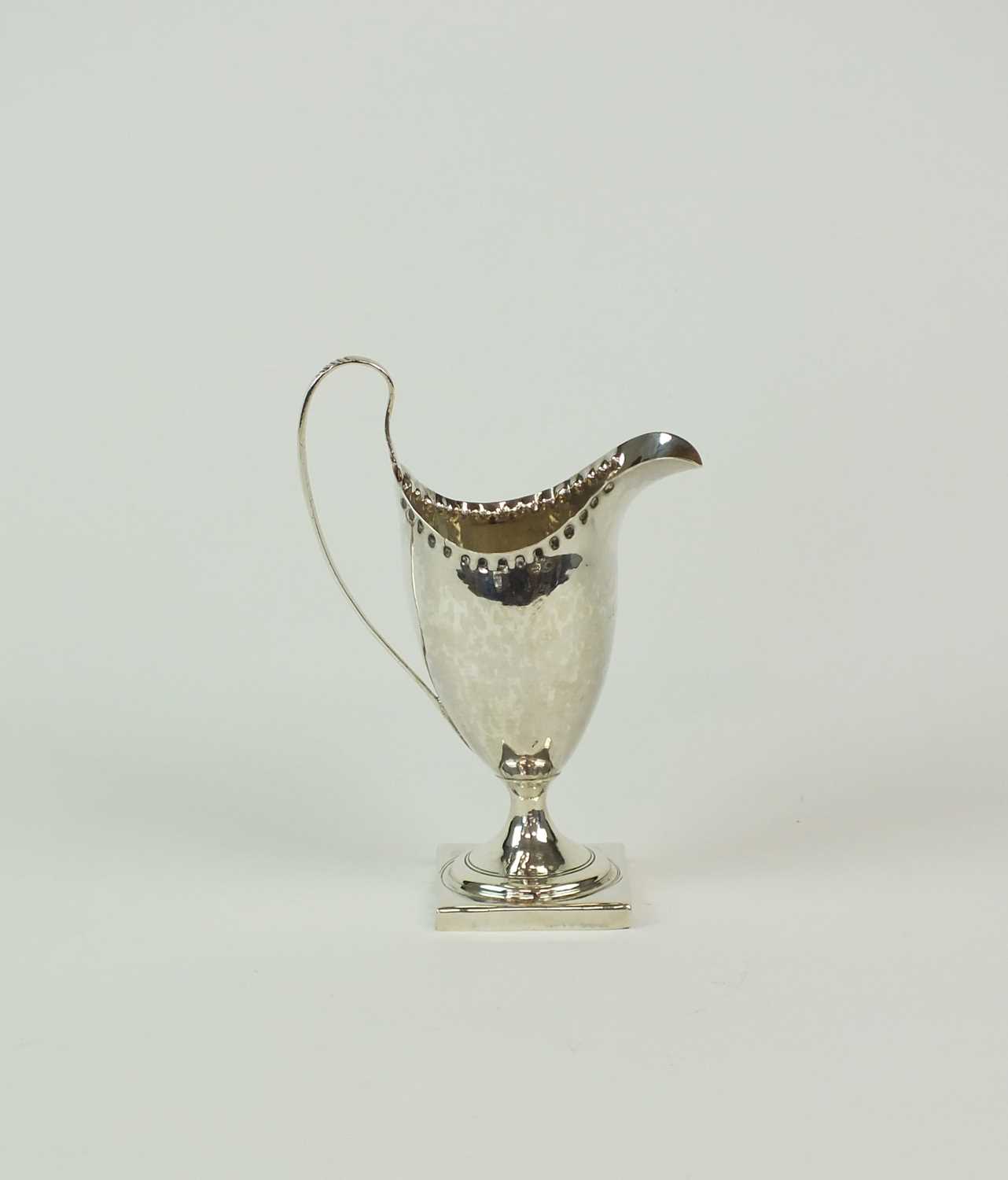 Lot 136 - A George III silver cream jug by Hester Bateman