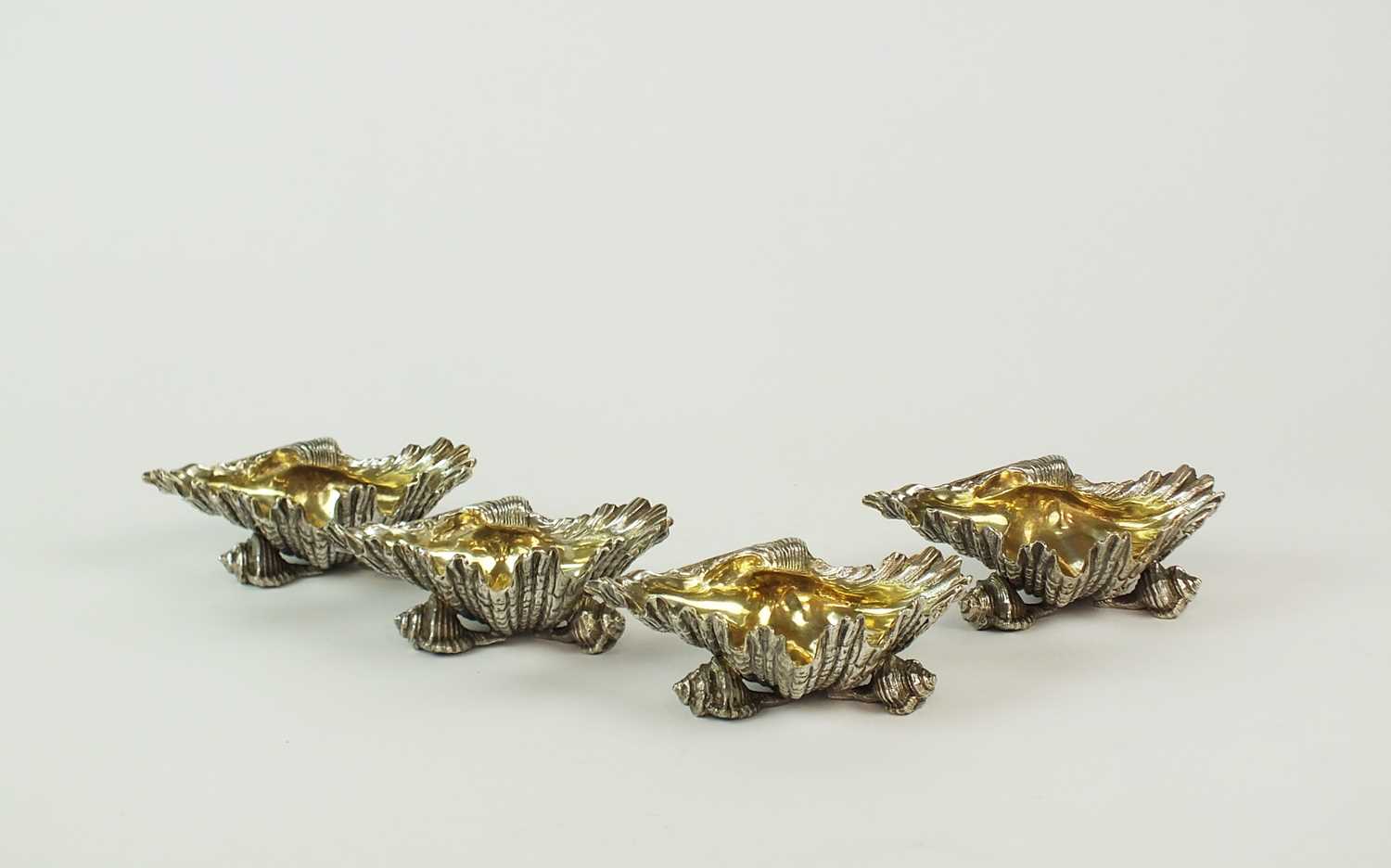 Lot 137 - A set of four Victorian Elkington & Co silver plated shell salts