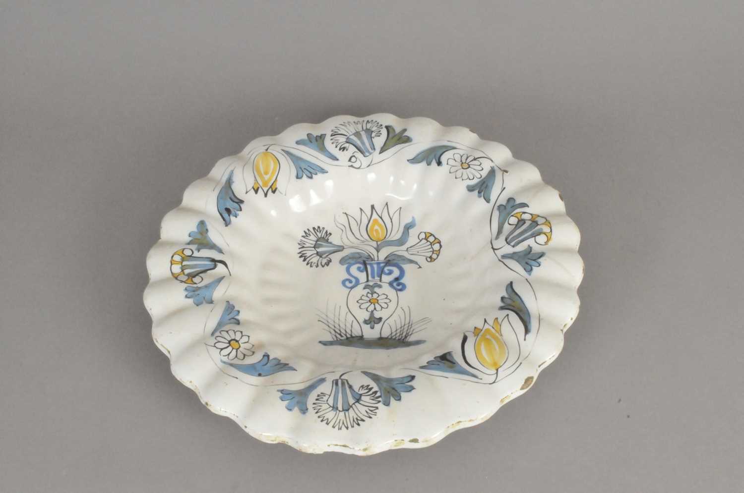 Lot 279 - Continental Delft lobed polychrome charger, 19th century