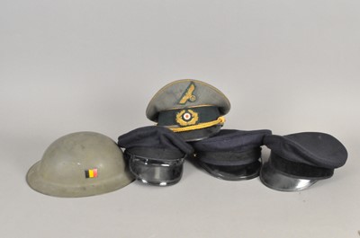 Lot 305 - Collection of visor caps and a Belgian helmet