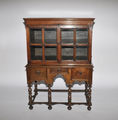 Lot 416 - A c1700 and later oak cabinet on an associated...