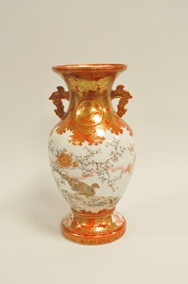 Lot 229 - A Japanese twin-handled Kutani vase, painted...