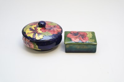 Lot 150 - A Moorcroft circular jar and cover together...