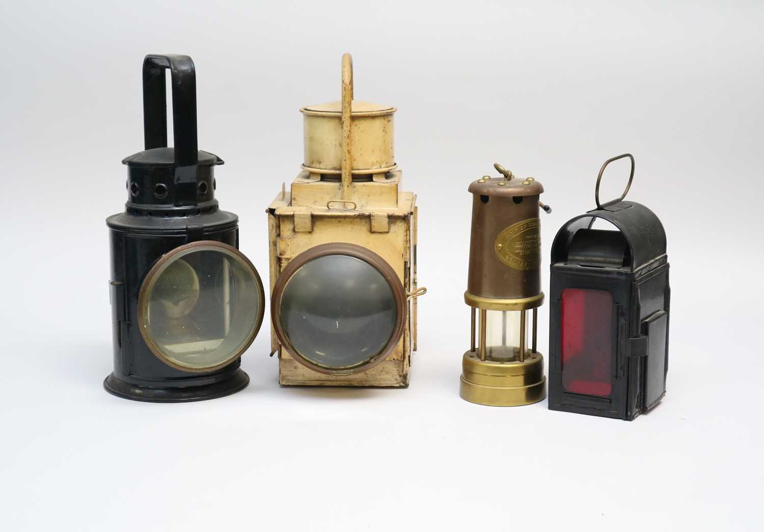 Lot 273 - Three various railway lanterns, the largest...