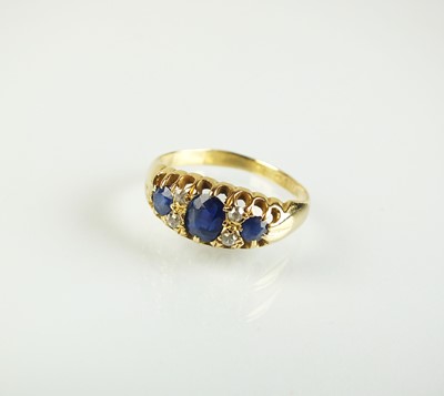 Lot 114 - An 18ct gold sapphire and diamond ring