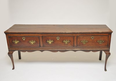 Lot 352 - A George III country oak sideboard, the...