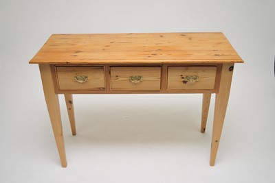 Lot 475 - A pale pine side table, the planked top with a...