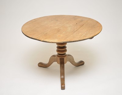 Lot 364 - A rustic pale pine tilt-top table, raised on a...