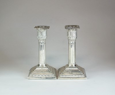 Lot 5 - A pair of Victorian silver mounted candlesticks