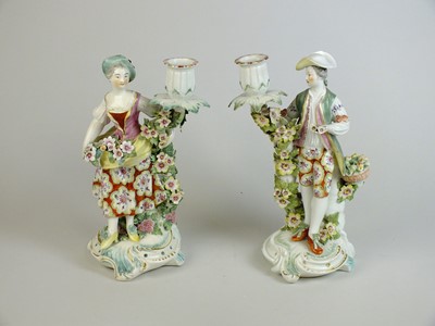 Lot 246 - A pair of Derby porcelain candlesticks, circa 1760