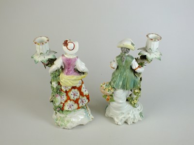 Lot 246 - A pair of Derby porcelain candlesticks, circa 1760