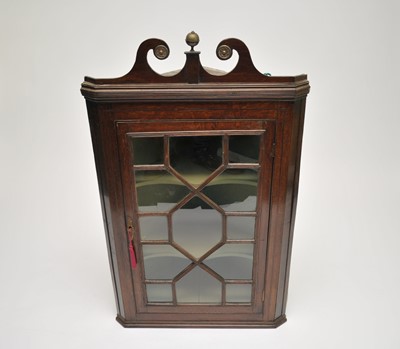 Lot 349 - A 19th century glazed-front oak wall-hanging...