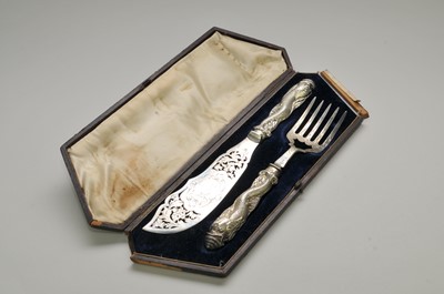 Lot 80 - A cased pair of 19th century silver handled fish servers