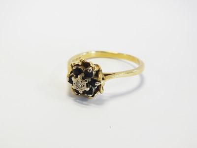 Lot 107 - An 18ct gold sapphire and diamond ring