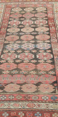 Lot 546 - A small old eastern woven wool runner,...