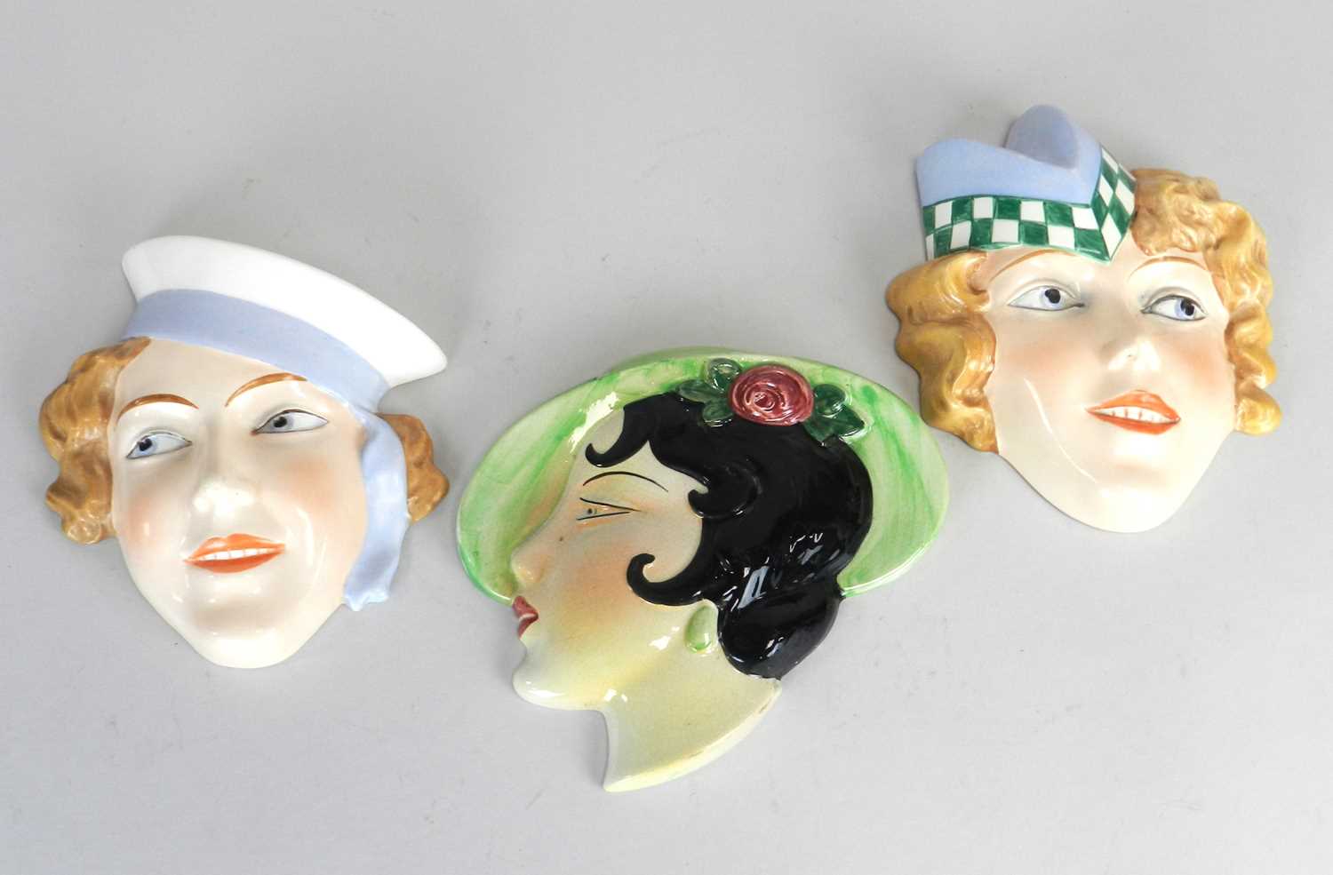 Lot 206 - Three Art Deco wall masks