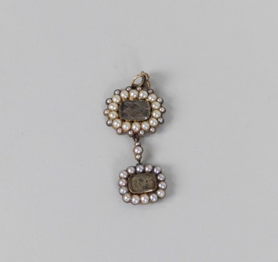 Lot 148 - A mid-19th century split seed pearl set mourning pendant